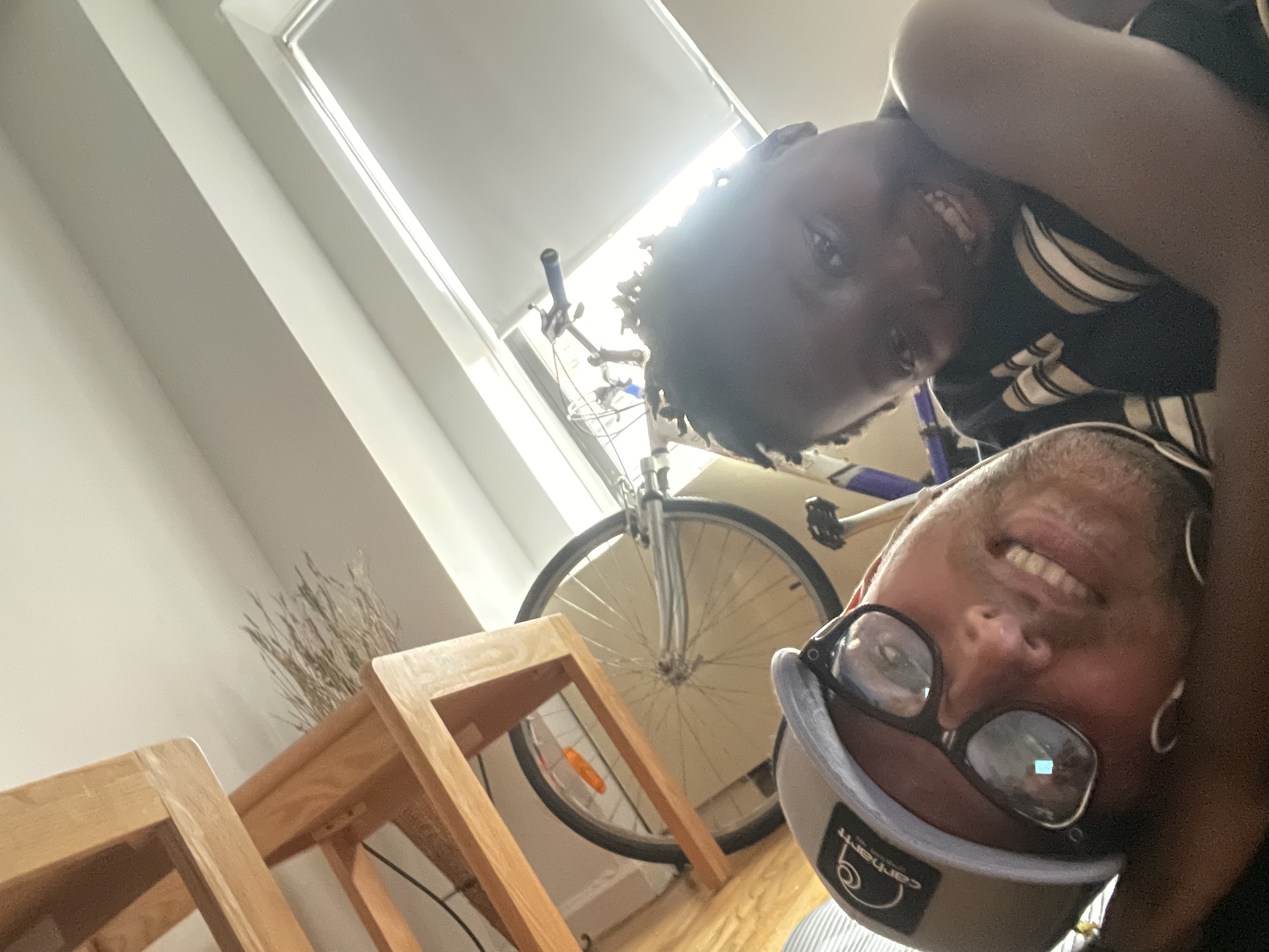 A father and son holding hands, looking at a city skyline.